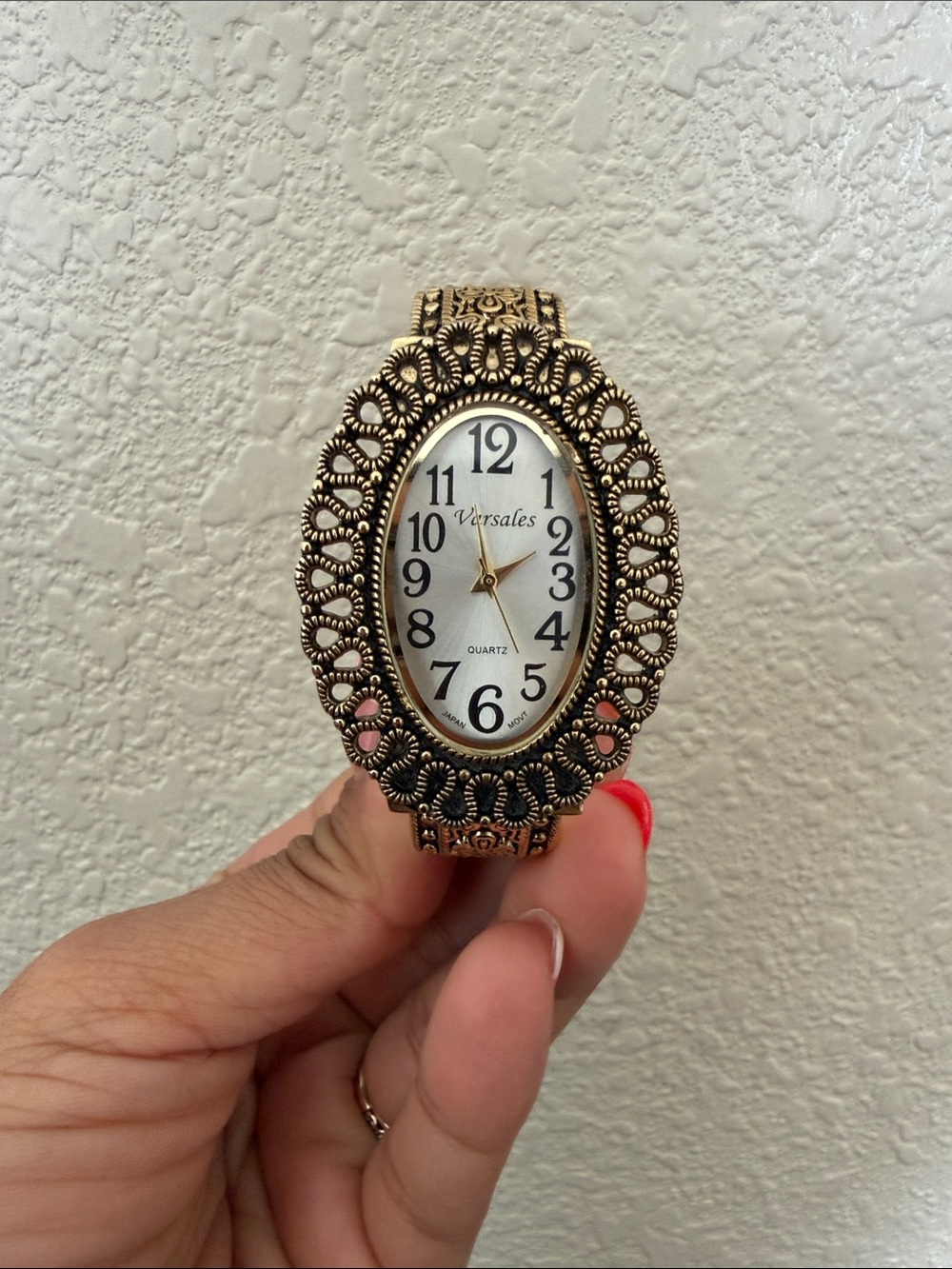 Gold Tone Ornate Oval Quartz Clock Bracelet